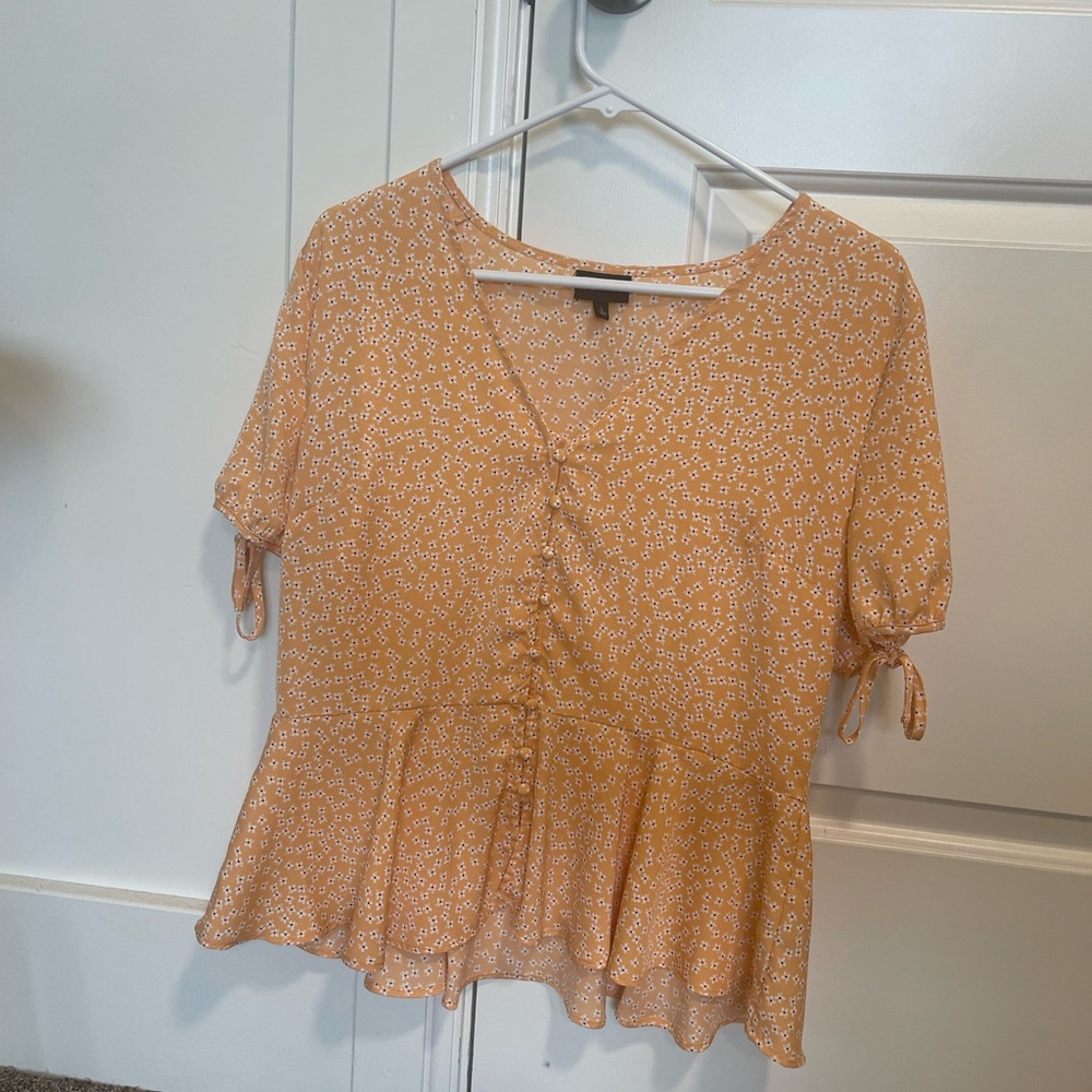 Good as new Womens Blouse! A light yellow color with a silky texture!
